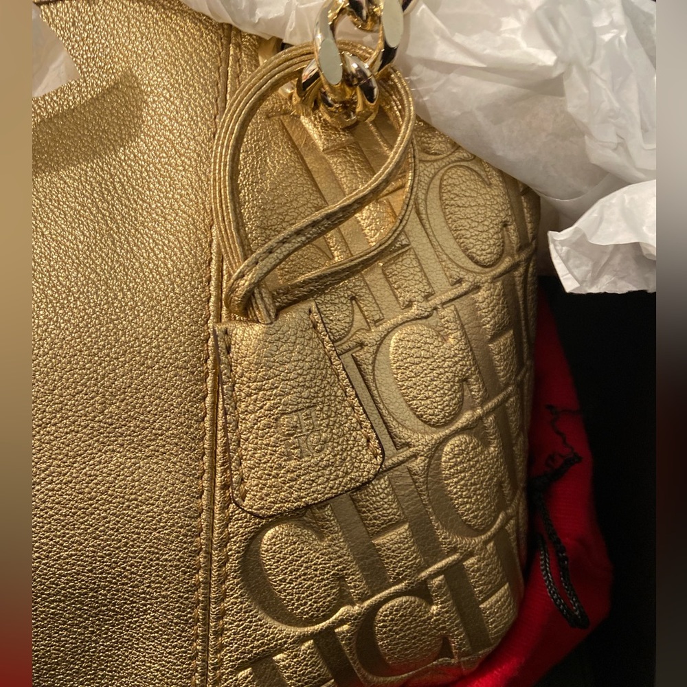 Carolina Herrera Gold bag. Never used. Opened only for photos. ALL SALES FINAL.